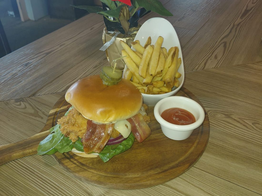 Loaded chicken burger with bacon and crispy fries