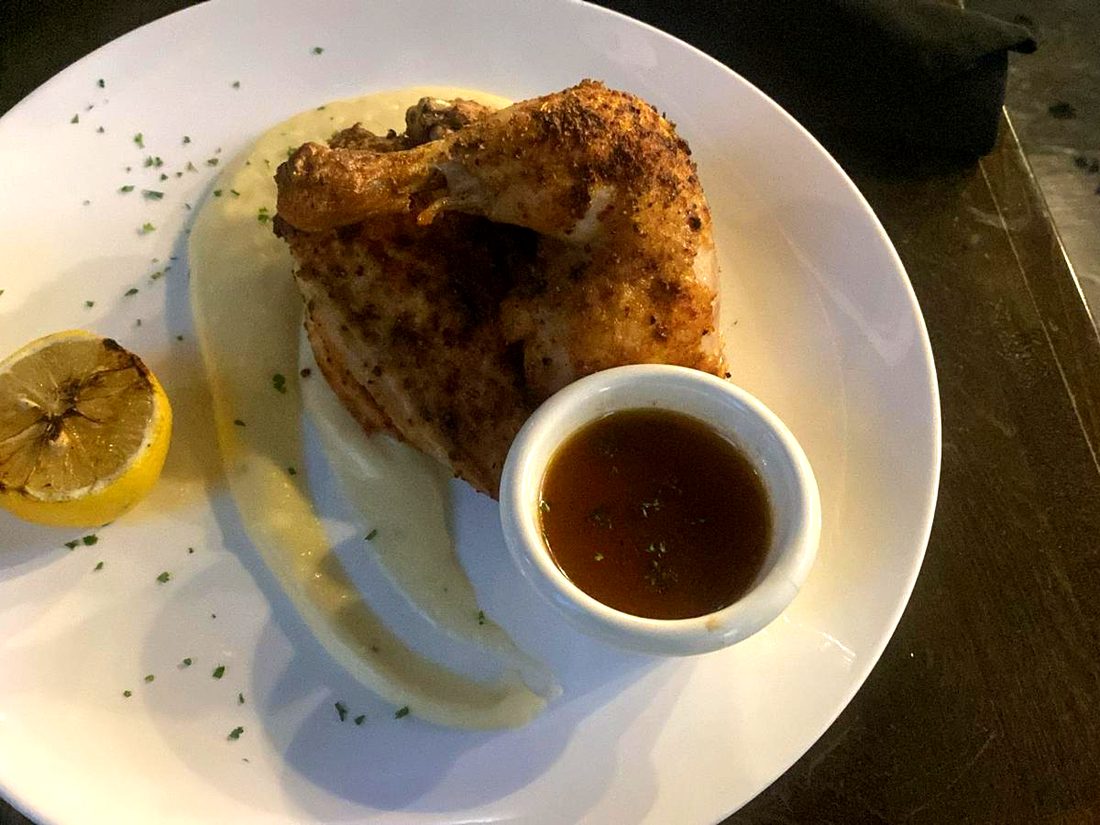 Herbed roasted half chicken with charred lemon