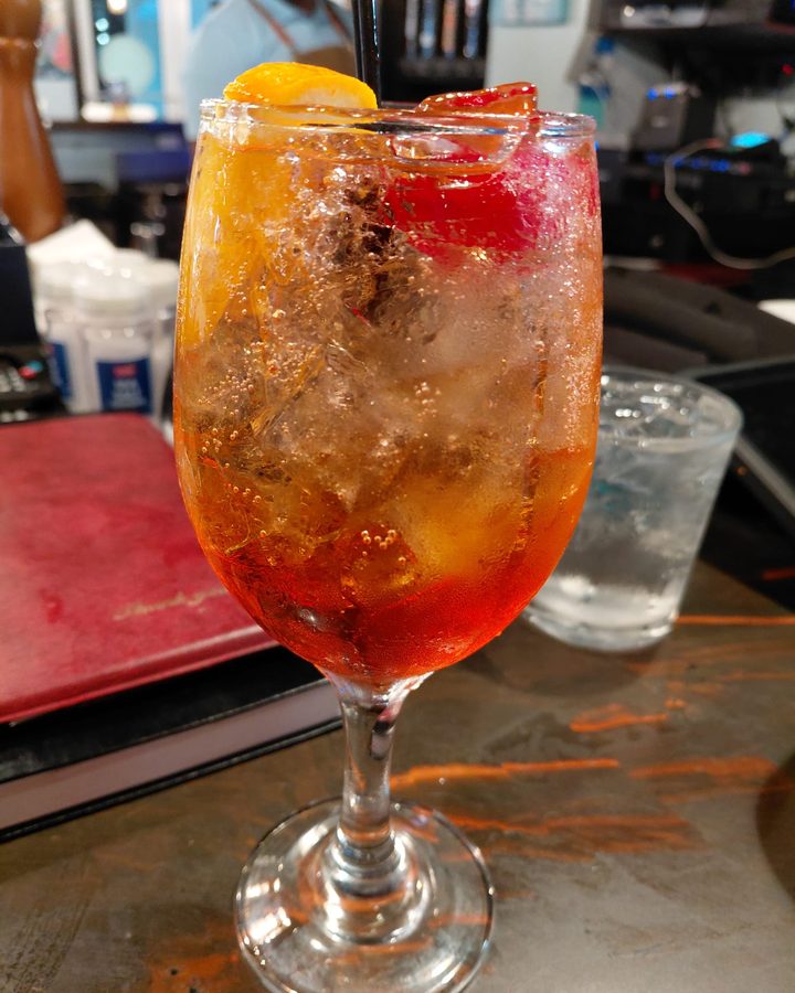 Aperol pineapple spritzer over ice