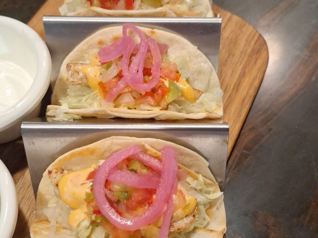 Catch of the day fish tacos with pico de gallo and pickled onion